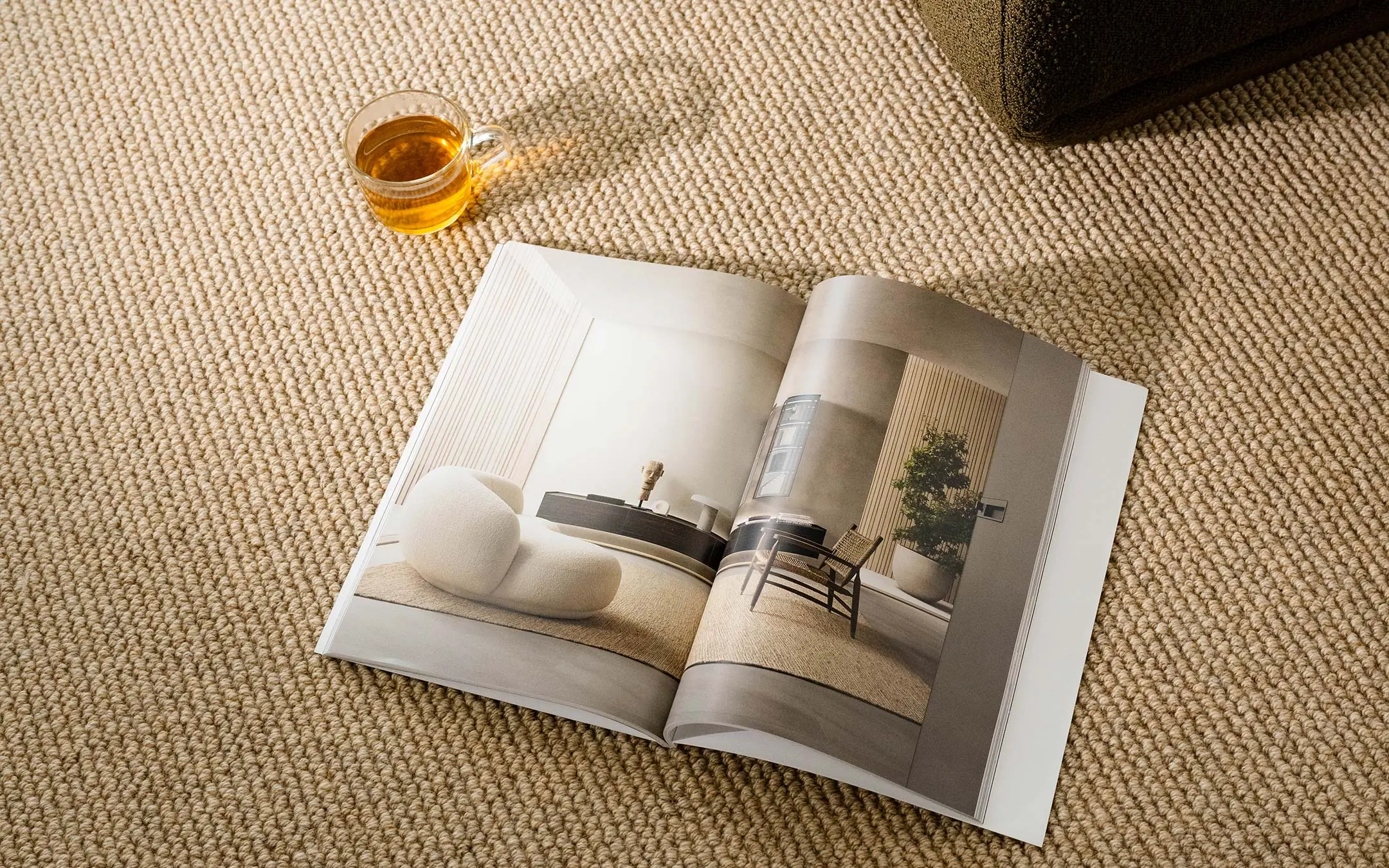 Book and tea on top of rug
