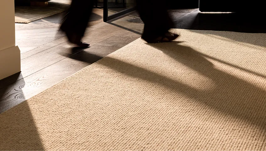 Man walking on floor rug