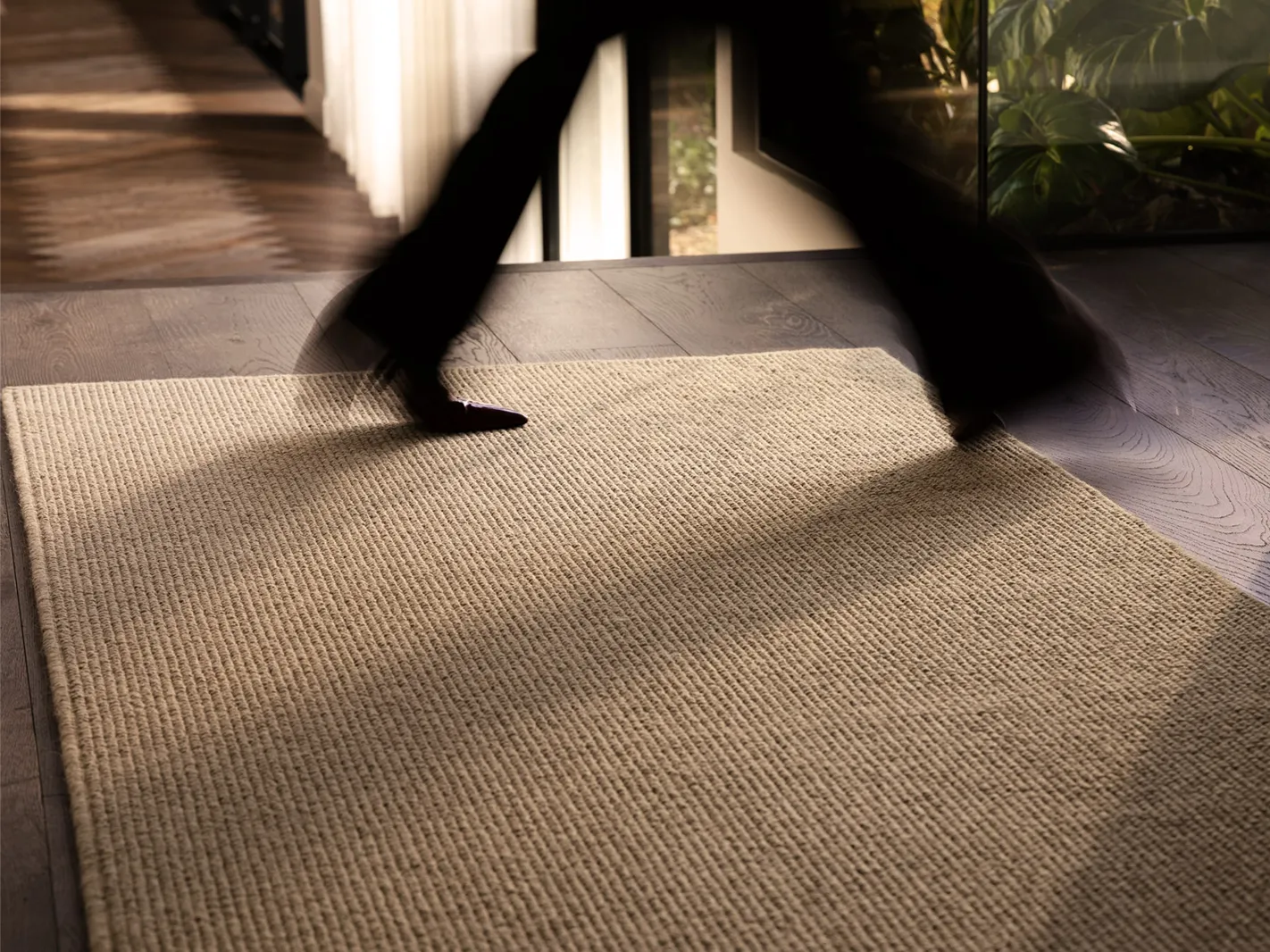Woman walking out from rug
